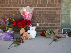 Following the on-duty death of RCMP officer Const. Shelby Patton, flowers and other gifts lay in a memorial at the front door of the RCMP detachment in Indian Head on June 13, 2021.