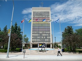 Flags fly in front of City Hall in Regina, Saskatchewan on June 15, 2021. While many flags have been lowered to half staff to honour RCMP Const. Shelby Patton, who died on duty June 12, the flags in front of City Hall have not.