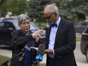 Dr. Francis Christian, a surgery professor at the University of Saskatchewan, speaks at a press conference outside Walter Murray Collegiate for a group called Concerned Parents Saskatchewan to address their issues with students being vaccinated in Saskatoon, Thursday, June, 17, 2021. Dr. Chong Wong, who is also seen in this photo, also lectures at the University of Saskatchewan. Kayle Neis/`Saskatoon StarPhoenix