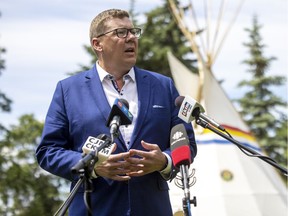 Premier Scott Moe scrums with reporters at the residential school memorial site dedication at Government House. TROY FLEECE / Regina Leader-Post
