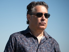 Filmmaker Lee Chambers stands on the grounds of the Moonlight Drive-in Theatre in Pilot Butte, Saskatchewan on June 16, 2021. Chambers has two films that will be showing Thursday night at the drive-in.