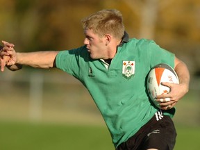 Lee Moffatt of the Regina Rogues men's rugby team carries the ball in a 2006 match against the Saskatoon Wild Oats. Moffat is among countless players who have suited up for the Rogues since their inception 40 years ago.