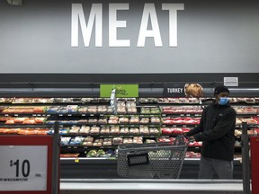 A man shops in the meat section at a grocery store, April 28, 2020 Washington, DC.