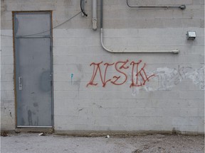 A street gang tag is painted on a building in Regina on Mar 18, 2020.