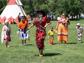 Dancers are seen performing an open category song during the Buffalo Day come-and-go cultural celebration held in the newly-renamed Buffalo Meadows Park in Regina, Saskatchewan on July 1, 2021.