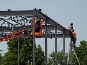 A crew works on a new commercial building near the Northgate Mall in Regina, Saskatchewan on July 13, 2021. The construction industry is beginning to feel pressures from an increasingly tight labour market,