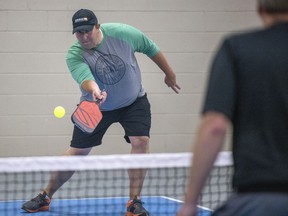 REAL president and CEO Tim Reid takes part in one of the first games being played at the Queen City Pickleball Hub at the REAL Campus on Saturday, July 17, 2021 in Regina.