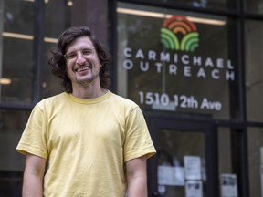 Nick Faye, development coordinator at Carmichael Outreach, stands outside their building on Wednesday, July 21, 2021 in Regina.