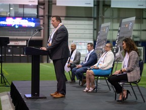 REAL CEO Tim Reid, at podium, speaks to attendees and media regarding the future of the AffinityPlex Indoor Soccer Centre during a news conference held at the centre in Regina.