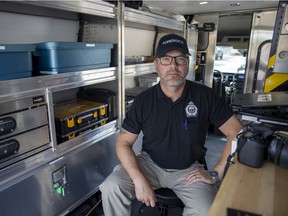 Corp. Keith Malcolm with the Forensic Identification Unit, inside the new van the Regina Police Service purchased.