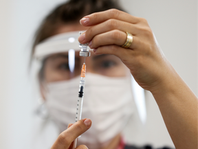 A nurse prepares a dose of the Pfizer-BioNTech COVID-19 vaccine at Ankara City Hospital in Ankara, Turkey, on April 2, 2021.