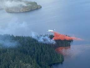 A fire team attacks a blaze from the air in northern Saskatchewan on July 16, 2021.