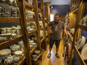 Jeffrey Taylor stands inside the retail space at his pottery studio in Duval.
