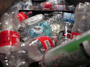 Plastic bottles travel up the conveyor belt at the SARCAN recycling depot at 1421 Fleury Street on Mar. 23, 2011.