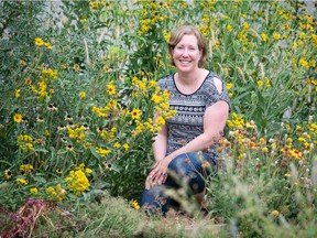 REGINA, SASK : August 3, 2021  -- Local botanist Sarah Vinge-Mazer kneels among some of the plants growing in the garden on the south side of the Royal Saskatchewan Museum.

BRANDON HARDER/ Regina Leader-Post