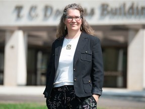 Kyla Clincke stands in front of the T.C. Douglas Building in Regina. Clincke is a Waste Management Coordinator for Saskatchewan and a jewelry artist who incorporates used goods into her work as a means of recycling.