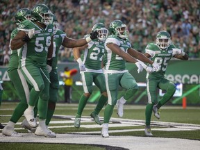 Saskatchewan Roughriders running back William Powell (29), second from right, celebrates his touchdown run against the B.C. Lions at Mosaic Stadium on Friday.

TROY FLEECE / Regina Leader-Post