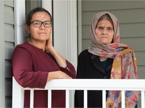 Zahra Karimi, left, who is originally from Afghanistan, and her mother Fatemeh Mohammadi stand in front of their home in Regina on August 17, 2021. They spoke with the Leader-Post regarding recent events in Afghanistan and their concerns about the safety of their family members who were trying to flee that country.