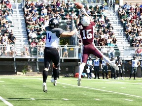 Regina Thunder defensive back Myles Bistritzan, 15, knocks down a pass intended for the Winnipeg Rifles' Riley Ho, 14, in Prairie Football Conference action Sunday at Leibel Field.