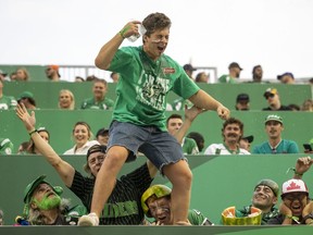A Saskatchewan Roughriders fan celebrates during the team's Aug. 6 season opener at Mosaic Stadium, where the home side defeated the B.C. Lions 33-29. It was the Green and White's first game in 628 days.