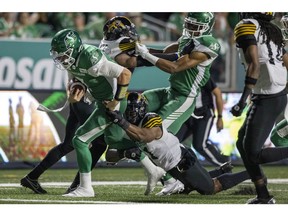 Saskatchewan Roughriders quarterback Cody Fajardo (7) runs the ball in for a touchdown against the Hamilton Tiger-Cats on Saturday, 
TROY FLEECE / Regina Leader-Post