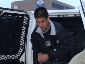 Aaron Nanaquetung getting out of a van (left) in 2001 on the way into court for sentencing. (File photo)