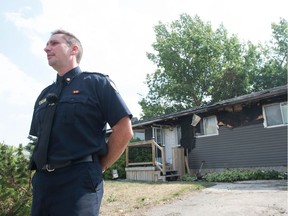 Regina Fire Chief Layne Jackson addresses the media in front of a burned out home on 12th Avenue North. on Aug. 21, 2018. The home burned after a fire started due to a carelessly discarded cigarette butt.