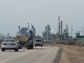 Vehicles drive down McDonald Street toward the Co-op Refinery Complex on April 8, 2021.