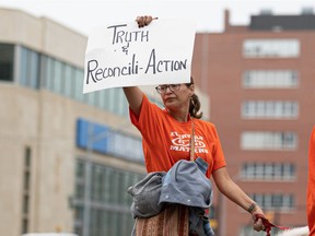 The streets of downtown Saskatoon were flooded with orange shirts and signs, showing support for the TRC Calls to Action during the TRC Calls to Action Awareness and Education Walk on July 20, 2021.