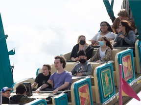 Fairgoers enjoy the rides at the Queen City Ex in this file photo from Aug. 25, 2021.