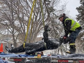 A statue of  John A. Macdonald is removed from Regina's Victoria Park in the early morning of April 13, 2021. Photo supplied by the City of Regina.