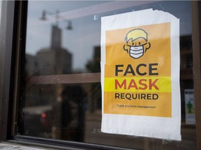 A face mask required sign is taped to the window of a downtown business in Saskatoon. Photo taken in Saskatoon on Thursday, September 9, 2021.