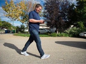 Conservative Party of Canada candidate Andrew Scheer walks from home to home, door knocking in a neighbourhood within his constituency in Pilot Butte, Saskatchewan on Sept. 14, 2021.