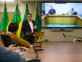 Premier Scott Moe, joined remotely by SHA CEO Scott Livingstone and Chief Medical Officer Dr. Saqib Shahab, addresses media in a press conference announcing mandatory masking and the implementation of a vaccine passport in response to rising COVID-19 infections and increased hospitalizations. Photo taken in Saskatoon, SK on Thursday, September 16, 2021.