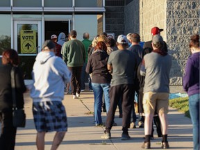 People line up to cast their ballots in the 2021 federal election at the Shaw Centre in Saskatoon.