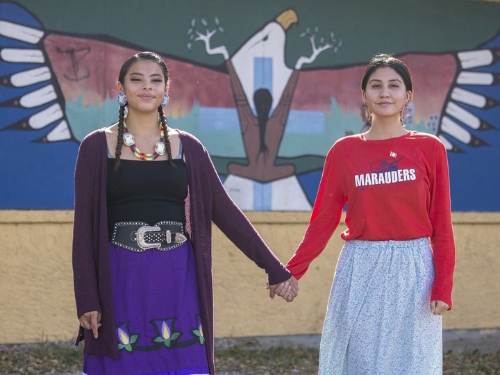  Meadow Musqua, left, and Kiana Francis hold hands together outside the Indigenous Christian Fellowship building on Tuesday, September 28, 2021 in Regina.