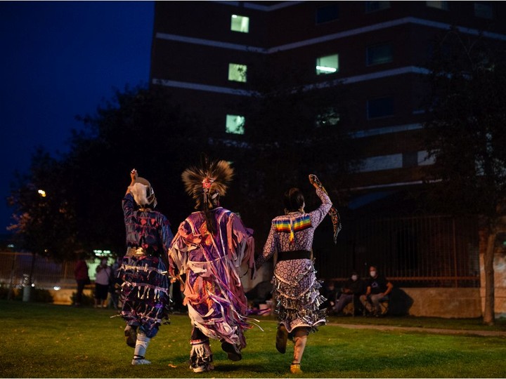  Meadow Musqua, left, Kiana Francis, right, and Robb Starr Mcnabb dance as part of a performance to show support for those in hospital, including those suffering from COVID-19, in front of the Regina General Hospital in Regina, Saskatchewan on Sept. 28, 2021.