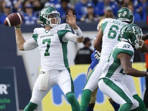 Saskatchewan Roughriders quarterback Cody Fajardo (7) throws during the first half of CFL action against the Winnipeg Blue Bombers in Winnipeg, Saturday, Sept. 11, 2021.