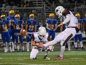 Eric Maximuik, shown with holder Branden Janotta, kicks one of the three field goals he made for the Regina Thunder on Saturday in an 18-17 road victory over the host Regina Thunder. Maximuik made a 51-yard game-winner on the final play at SMF Field.