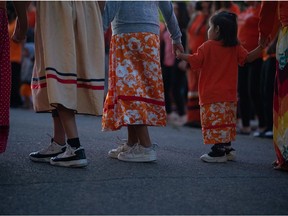 People participate in a round dance during a gathering at the Saskatchewan Legislative Building on National Day for Truth and Reconciliation in Regina, Saskatchewan on Sept. 30, 2021.