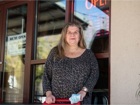 Anna Gardikiotis, one of the family owners of The Copper Kettle, stands in front of the restaurant on Scarth Street in Regina, Saskatchewan on Oct. 1, 2021. Gardikiotis and other restaurant owners in the province are now having to ask customers for proof of COVID-19 vaccine.

BRANDON HARDER/ Regina Leader-Post