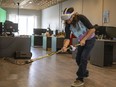 Rene Dufour-Contreras, fabricator and engineer at Melcher Studios, demonstrates their new virtual reality hockey game.