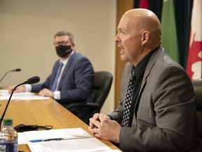 Premier Scott Moe, left, and Saskatchewan Public Safety Agency president Marlo Pritchard speak during a COVID-19 update at the Legislative Building on Oct. 7, 2021 in Regina.