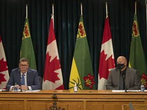 Premier Scott Moe, left, and Saskatchewan Public Safety Agency president Marlo Pritchard speak during a press conference on Oct. 7, 2021 announcing the province's emergency operations centre would handle the response to COVID-19.