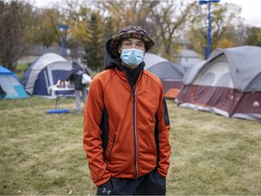 Homeless Reginan Gavin Siggelkaw, in front of the tent camp in the city's Pepsi Park on Oct. 12, 2021.