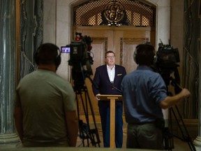 Saskatchewan Premier Scott Moe speaks to media, regarding the COVID-19 pandemic, in the rotunda in the Saskatchewan Legislative Building in Regina, Saskatchewan on Oct. 18, 2021. Moe addressed the media following a decision to send six patients, critically ill with COVID-19, to Ontario for care.