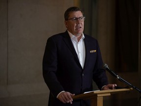 Saskatchewan Premier Scott Moe speaks to media, regarding the COVID-19 pandemic, in the rotunda in the Saskatchewan Legislative Building in Regina, Saskatchewan on Oct. 18, 2021. Moe addressed the media following a decision to send six patients, critically ill with COVID-19, to Ontario for care.