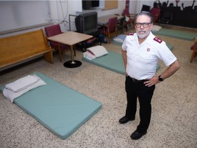 In this file photo from Oct. 19, 2021, Al Hoeft, who works for the Salvation Army, stands inside the overflow room at the Waterston Centre in Regina.