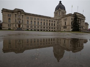 A reflection is seen in a puddle at the Saskatchewan Legislative Building in Regina, Saskatchewan on Oct. 26, 2021.