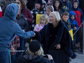 Independent MLA Nadine Wilson shakes hands with people in a large crowd in front of the Saskatchewan Legislative Building in Regina, Saskatchewan on Oct. 27, 2021. The gathering was a demonstration against proof of vaccine mandates and other pandemic measures.
BRANDON HARDER/ Regina Leader-Post